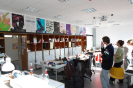 Students looking at the poster-results at the workshop